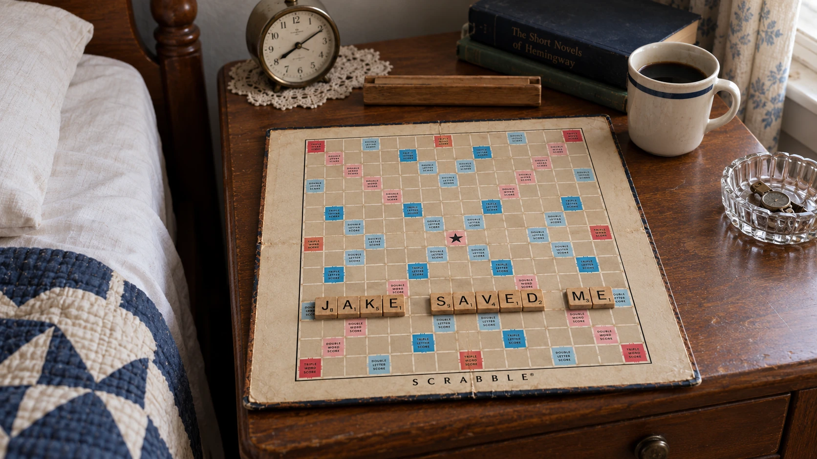 Wooden Scrabble tiles spelling JAKE SAVED ME on a board beside a hospital bed